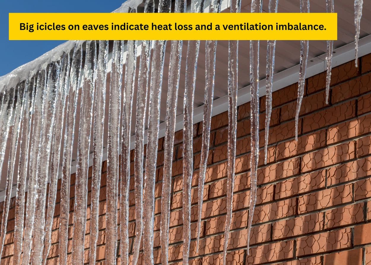 Long icicles hanging from a roof edge, showing poor winter ventilation and heat loss issues. Caption: Big icicles on eaves indicate heat loss and a ventilation imbalance.